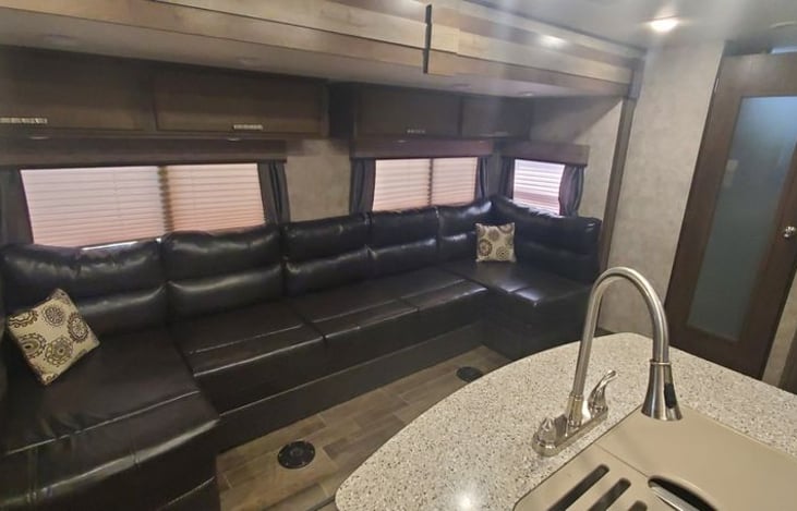 Dinning area with tables stored
Note: center of couch makes into queen airbed