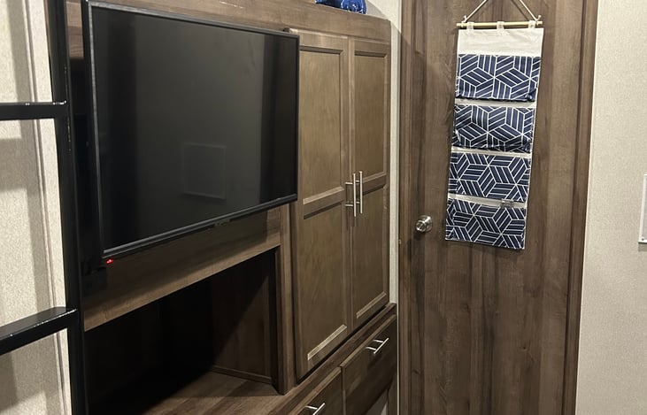 Kids bunk room.  Loft bed is located above the TV.