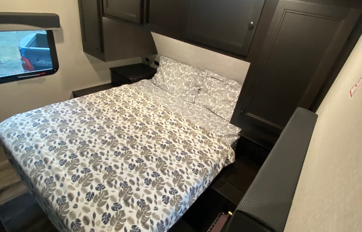 Gorgeous private master queen suite.  Storage above and manual lighting when required under storage cabinets.