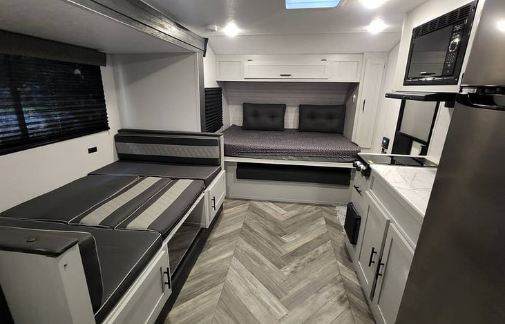 Dinette and murphy bed converted for sleeping.