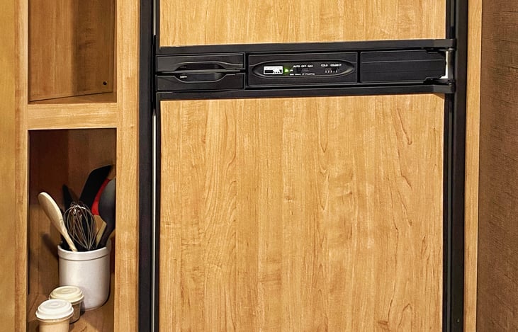 Refrigerator runs off campsite power, propane or generator
