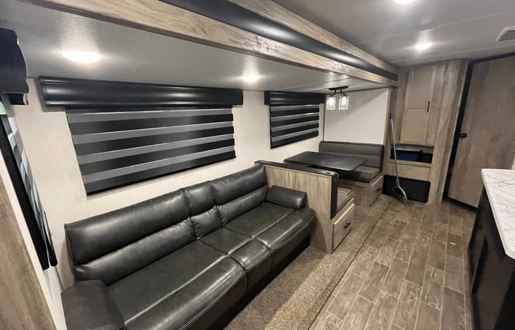 Living room. Both the dinette and the couch lay down to make beds.