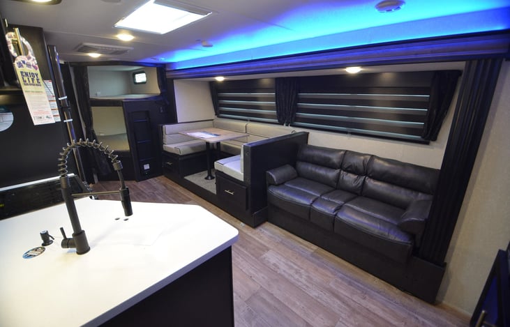 We love the “zebra shades” on this RV. Easily darken or lighten the room or anything in between. There is also a skylight that keeps the living area bright.