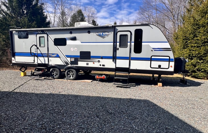 The travel trailer closed up and ready for travel.