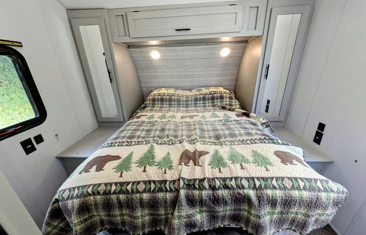 Cozy bedroom in the back with a comfortable queen bed.