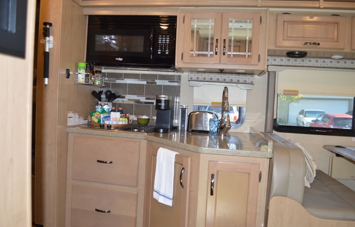 Kitchen comes with everything shown.  Large Microwave/Conv Oven combo.