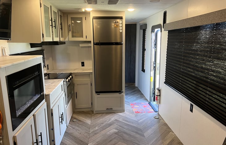 Spacious kitchen/garage area with a large picture window
