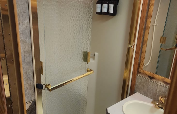 Upgraded Porcellean Commode with on demand tankless water heater for multiple showers