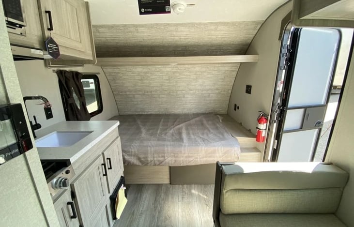 Comfy queen size bed.  All linens and luxury comforters will be provided.  Table section on right lifts for phone/watch/valuable item storage.