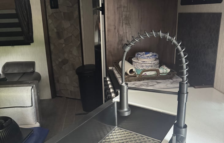 Kitchen, microwave, stove, main living with fridge and freezer