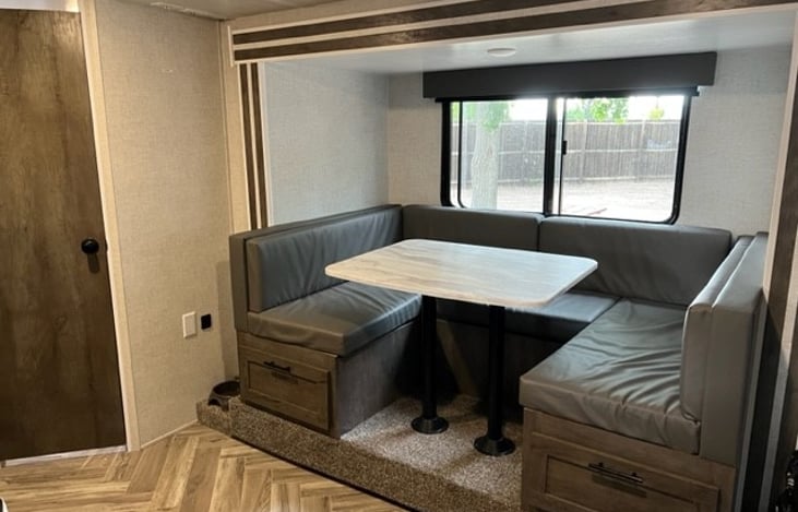 U-Shaped dinette slide out provides additional seating around the table. Converts into a second full size bed. Additional lower storage areas (carpeted).
