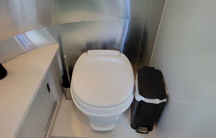 Toilet with step flush