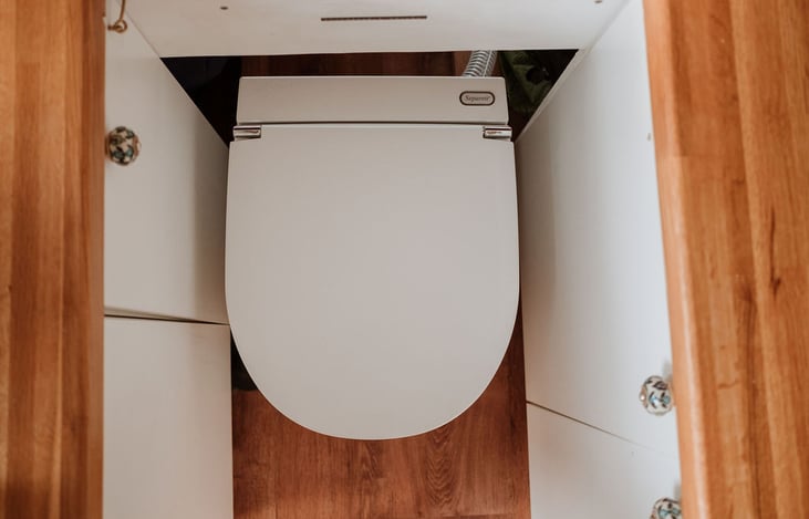 The dry toilet has a ventilation fan that pushes any bad smells outside the vehicle through and exhaust piping.