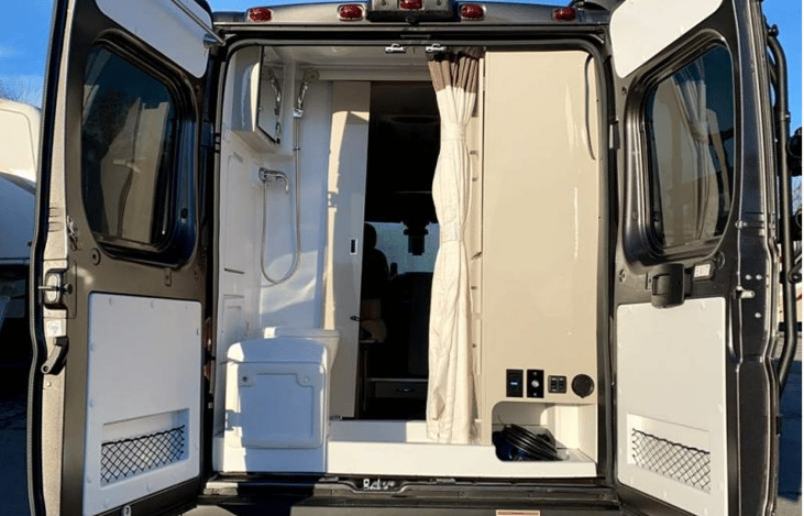 Has outside hose to spray off sand etc...