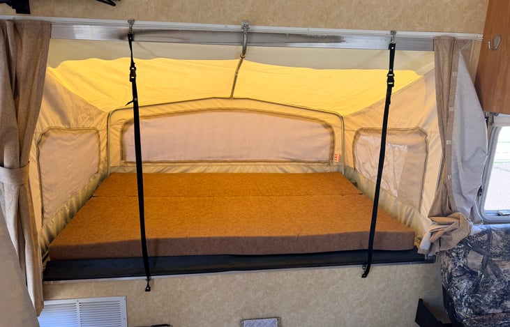 Side pop out bed