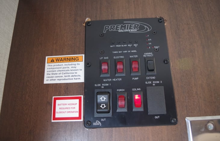 Control panel for lights, water pump, hot water selection- gas/electric. 12V outlet added next to control panel for ease of phone charging.