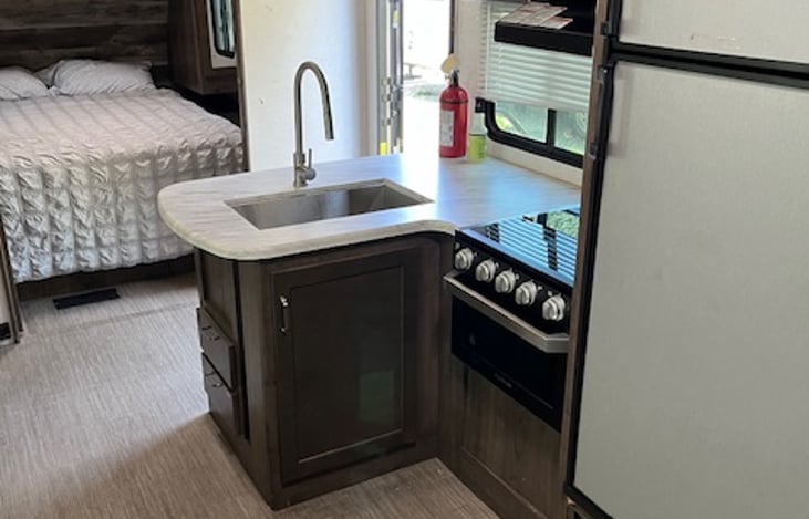 Kitchen looking toward queen master bedroom