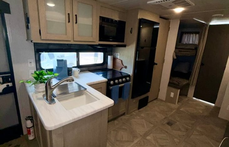 Coffee maker, pots and pans and dishwater.