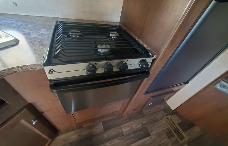Propane Stove and Oven. We include cooking utensils , pots, pans, and a cookie sheet.