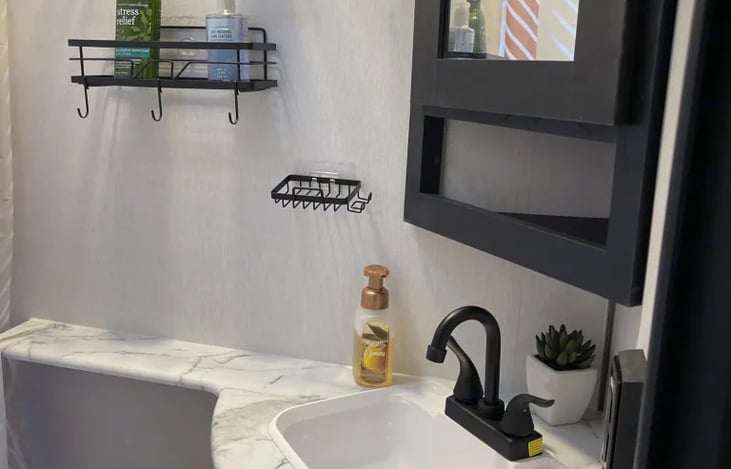 Bathroom w/ sink and toilet , tub with shower