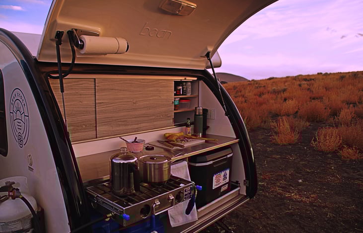 Propane, stove, cooler, and clean up sinks all included