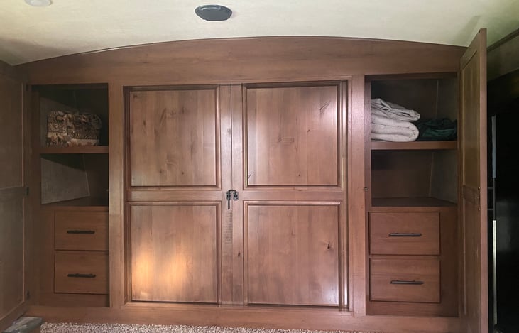 Wardrobe has set of drawers for 2 people