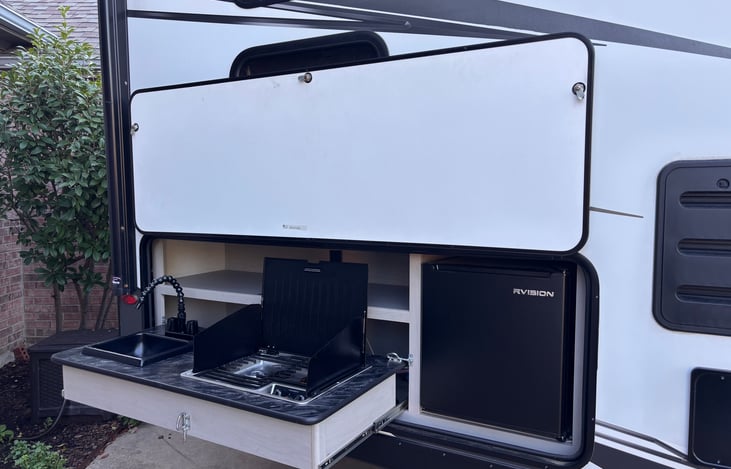 One of the BEST things about this RV is the awesome outdoor, two-burner stove with outdoor frig! It makes living outdoors even MORE amazing.