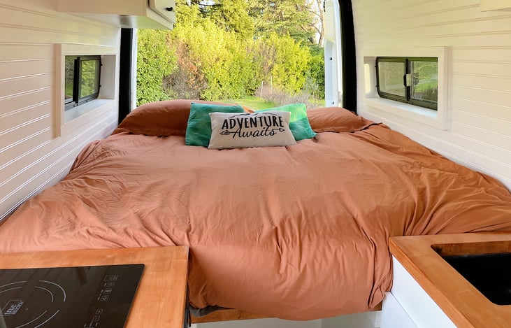 When converted to bed mode, this comfortable near King bed allows you to rest easy. Windows on both sides for maximum air flow. All bedding included.
