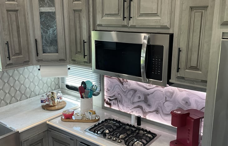 Gourmet Kitchen & Coffee Bar: Fully equipped modern kitchen with all utensils included, plus a dedicated Keurig coffee station to kickstart your mornings.