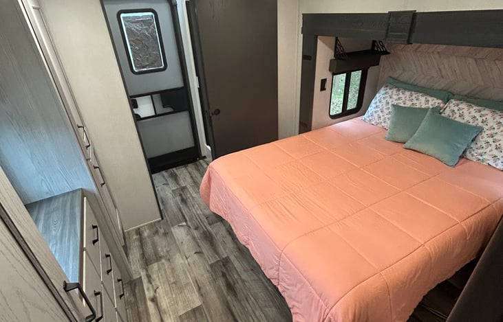 Bedroom 2 w/ Queen Bed, dresser drawers and 2 closet spaces