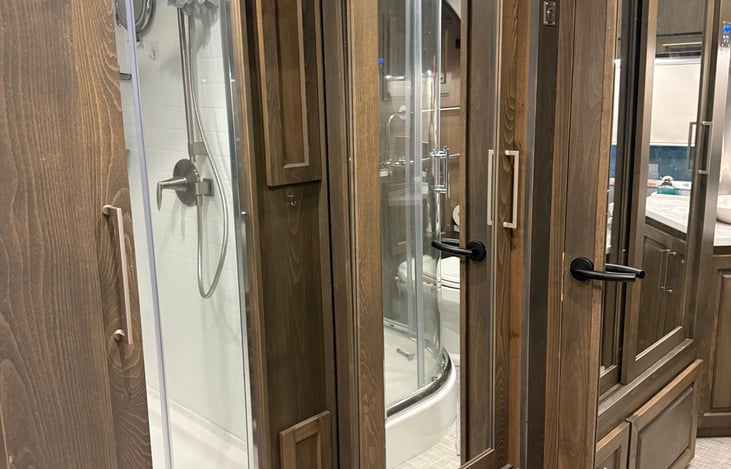 large closet with mirror