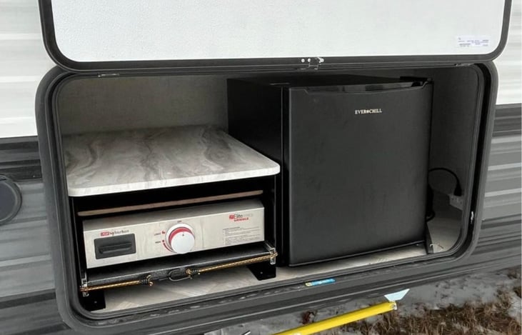 This outdoor kitchen setup is available for an extra fee