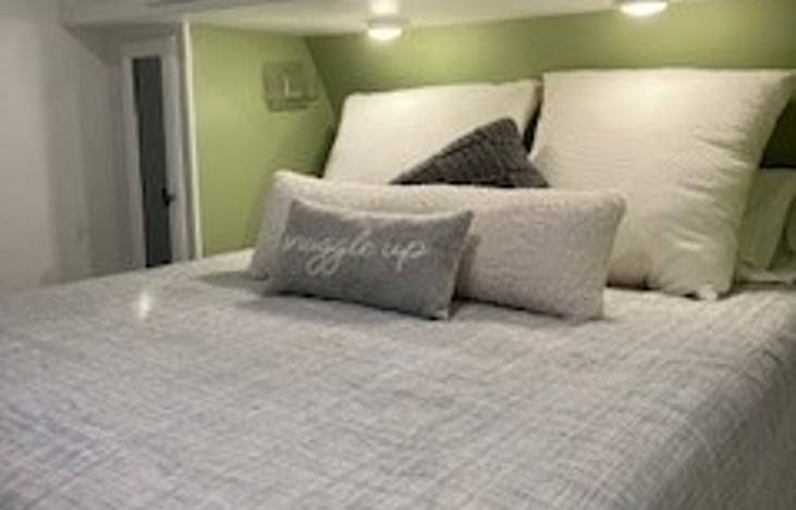 Bedroom provides a queen size bed with a comfortable, new mattress.
