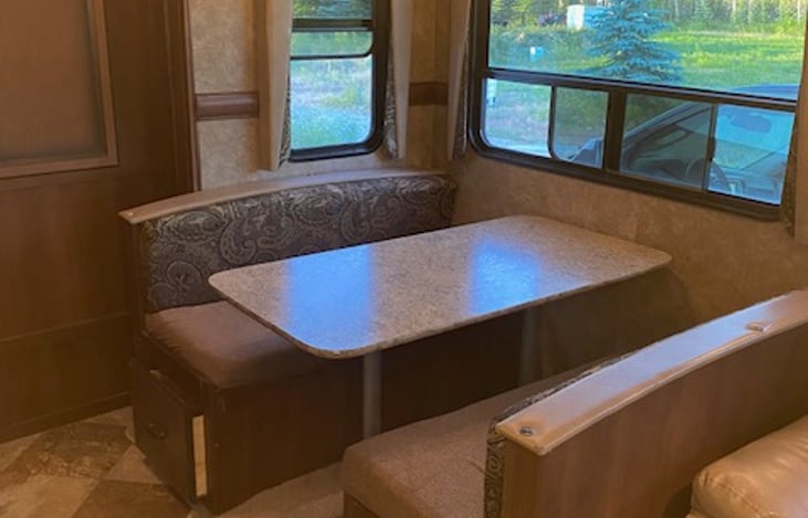 Dinning area with pull-out storage below seats