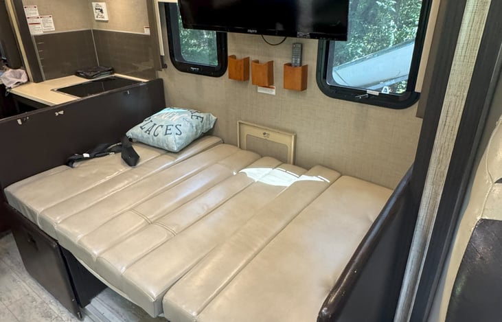 Table drops down to supply additional sleeping spots  .