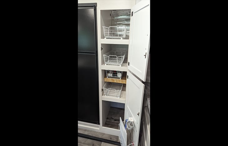 Extra roomy pantry with four slide-out storage baskets. Space on the bottom for larger items and added storage on the door.