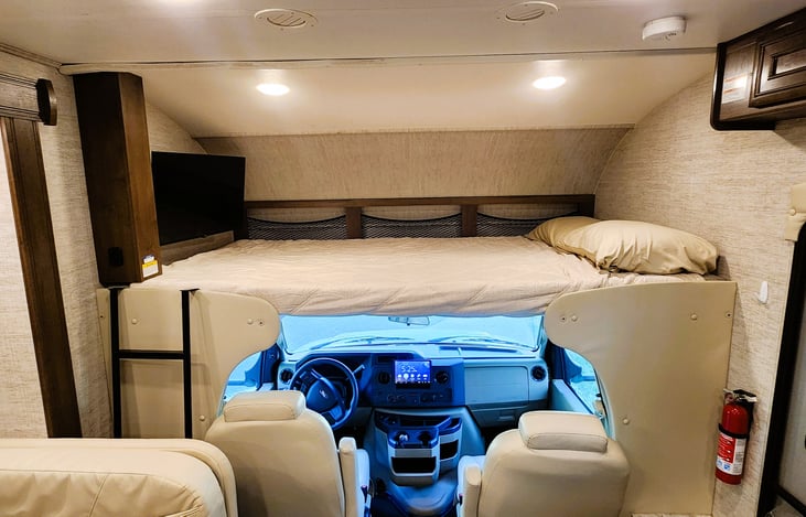 Over the cab bunk can handle up to 750 lbs so you can sleep 2 up here.