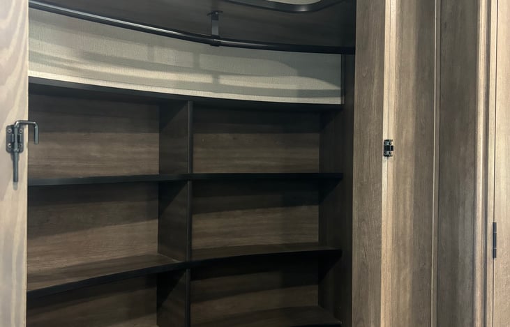 Inside Master bedroom closet behind sliding mirror doors