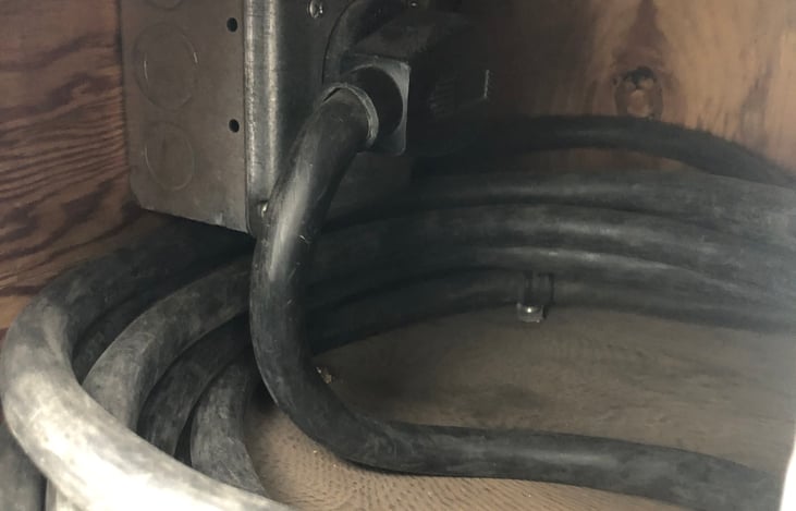 RV power cord can be plugged into the generator outlet (as shown here) or connected to shore power.