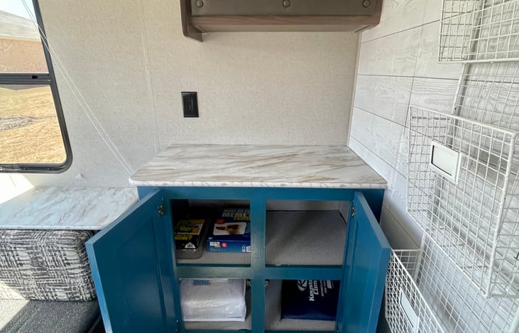 Additional storage for bags or anything you may want to put away.