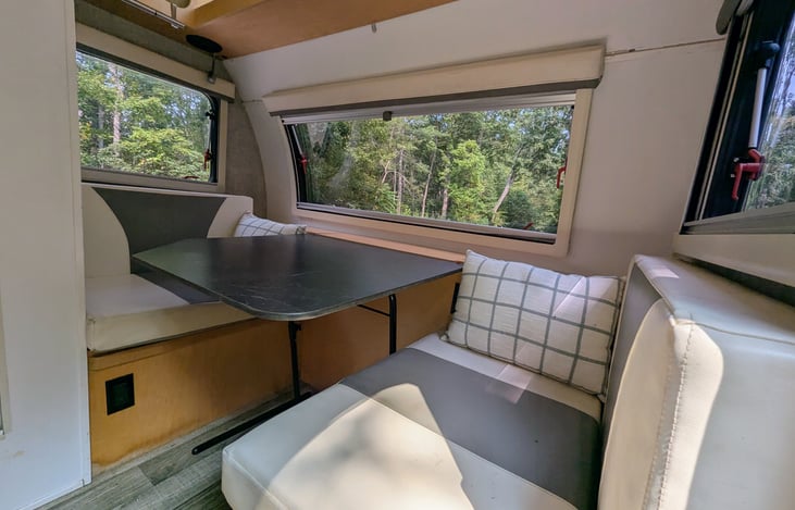 Cozy dinette surrounded by windows also converts to a second bed.