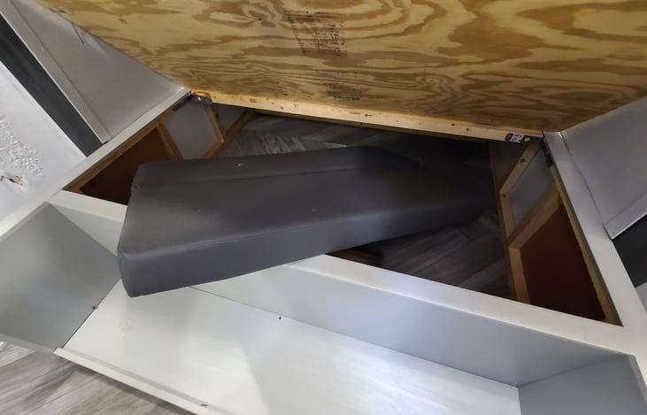 Cushion for dining bed can be stored in the main bedroom or dining storage area.