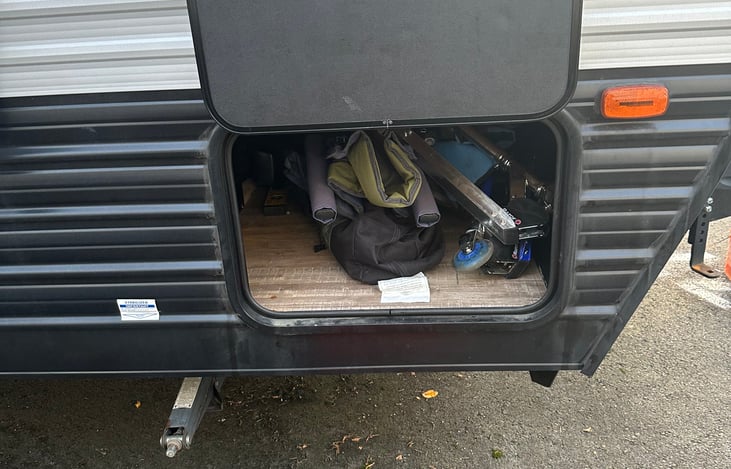 Outside storage has Camping chairs and Scooters!