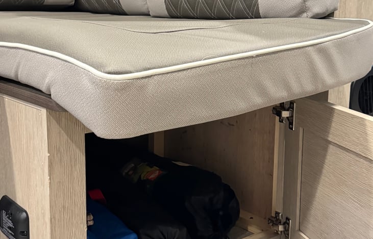 Camp chairs & plenty of storage under the couch.