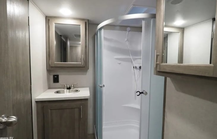 Two medicine cabinets with mirrors.