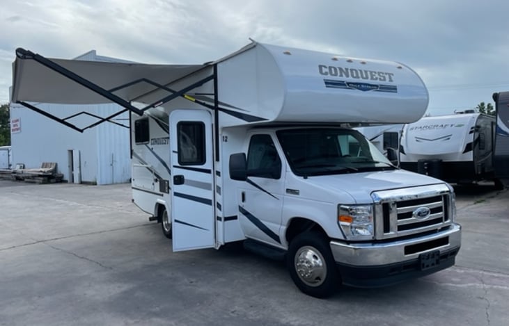 Passenger side view with the power awning fully extended.