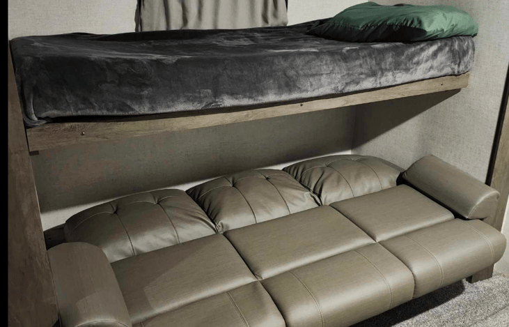 Jackknife couch converted into bed.