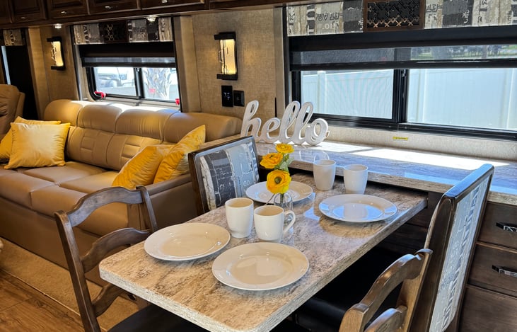 Coffee time! Table extends to seat 4 comfortably; storage above and around table.