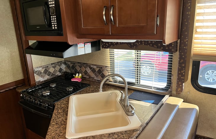 Kitchen with oven and microwave