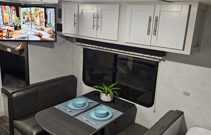 Dining table that converts to small bed.